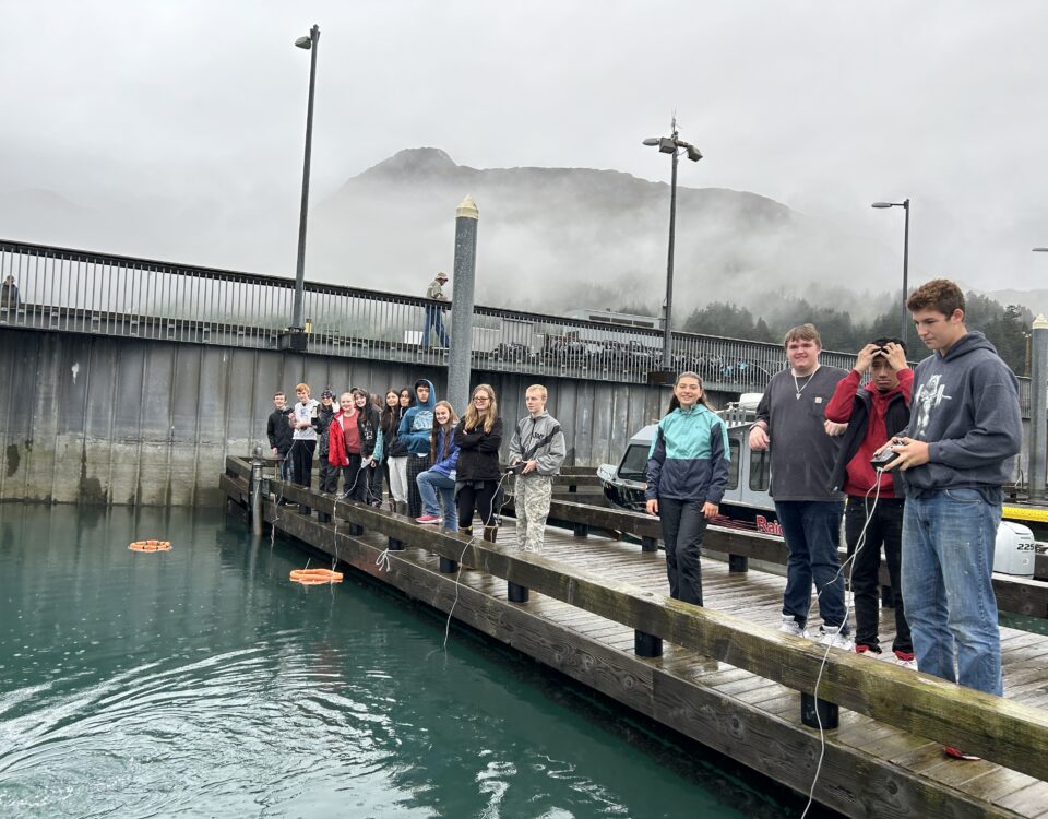 High school students at the harbor in Whittier testing their remotely operated vehicles (underwater robots) they build