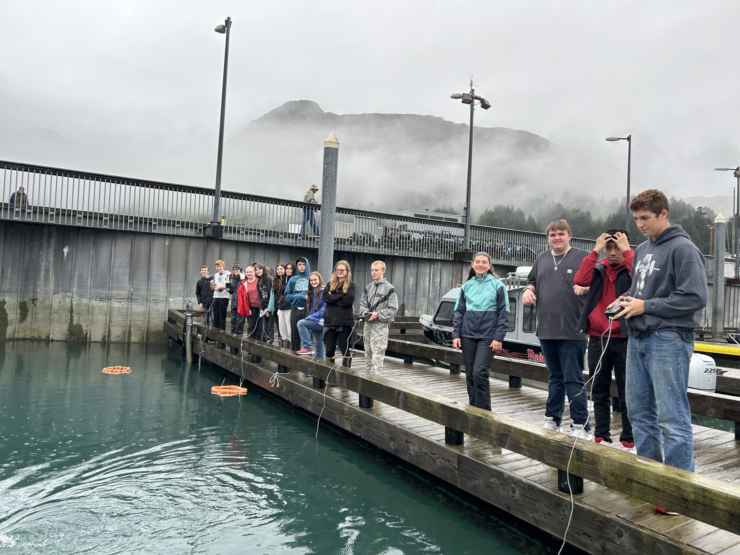High school students at the harbor in Whittier testing their remotely operated vehicles (underwater robots) they build