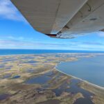 aerial photo of delta and ocean